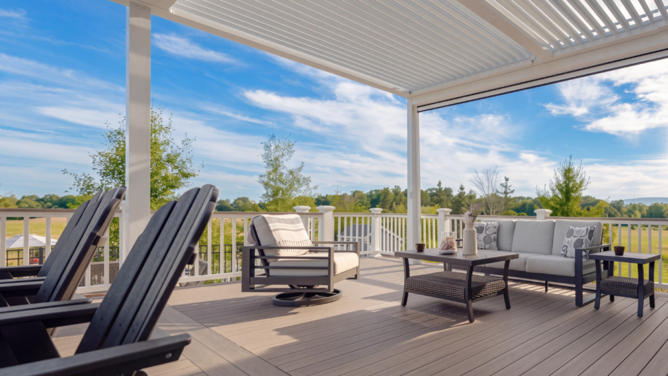 Outdoor living space featuring a custom pergola and comfortable gathering area
