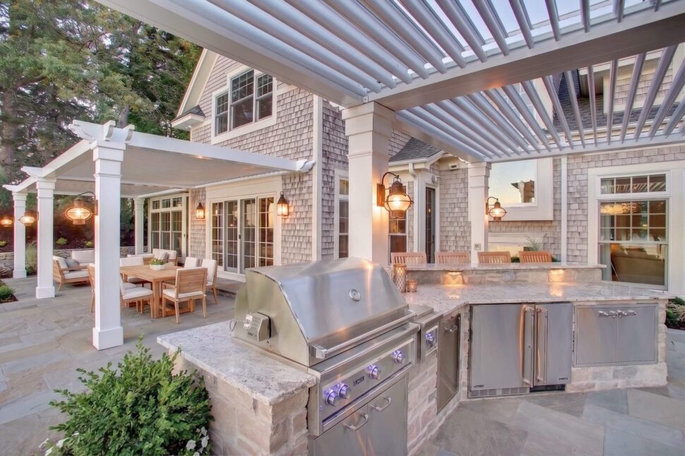 StruXure Pergola X structures framing a luxury pool patio with a central fire pit