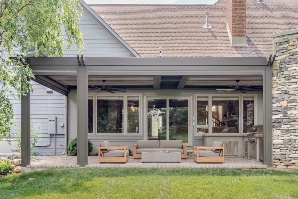 StruXure Pergola X with open louvers above a custom outdoor kitchen and grill